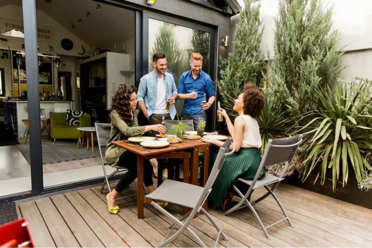 group of people having fun on backyard patio