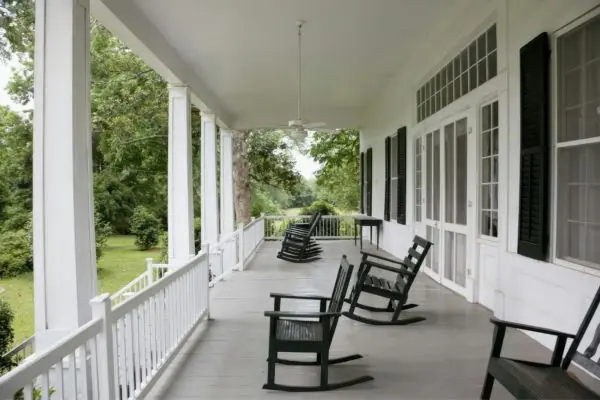 gray colored front porch with furnitures