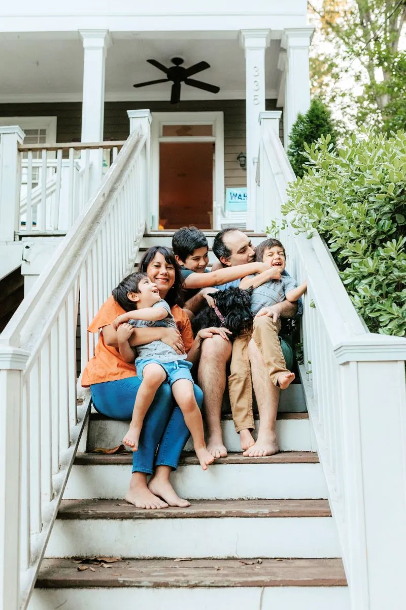 happy family on porch stair