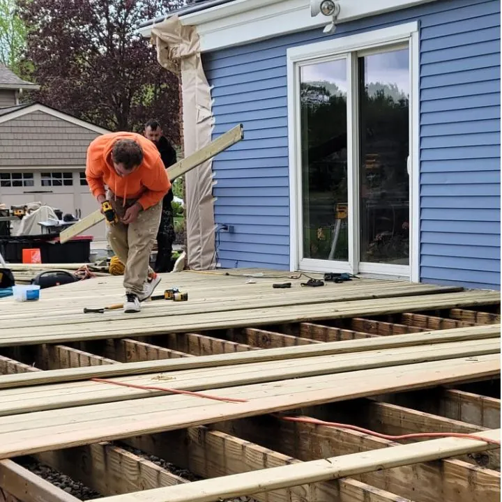 contractors building outdoor deck