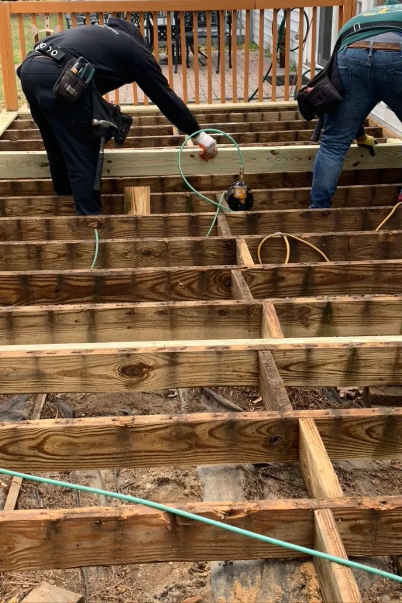 two contractors building a deck