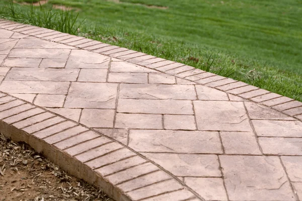 What Makes a Stamped Concrete Pattern “Modern” - Deck Builders College Station TX